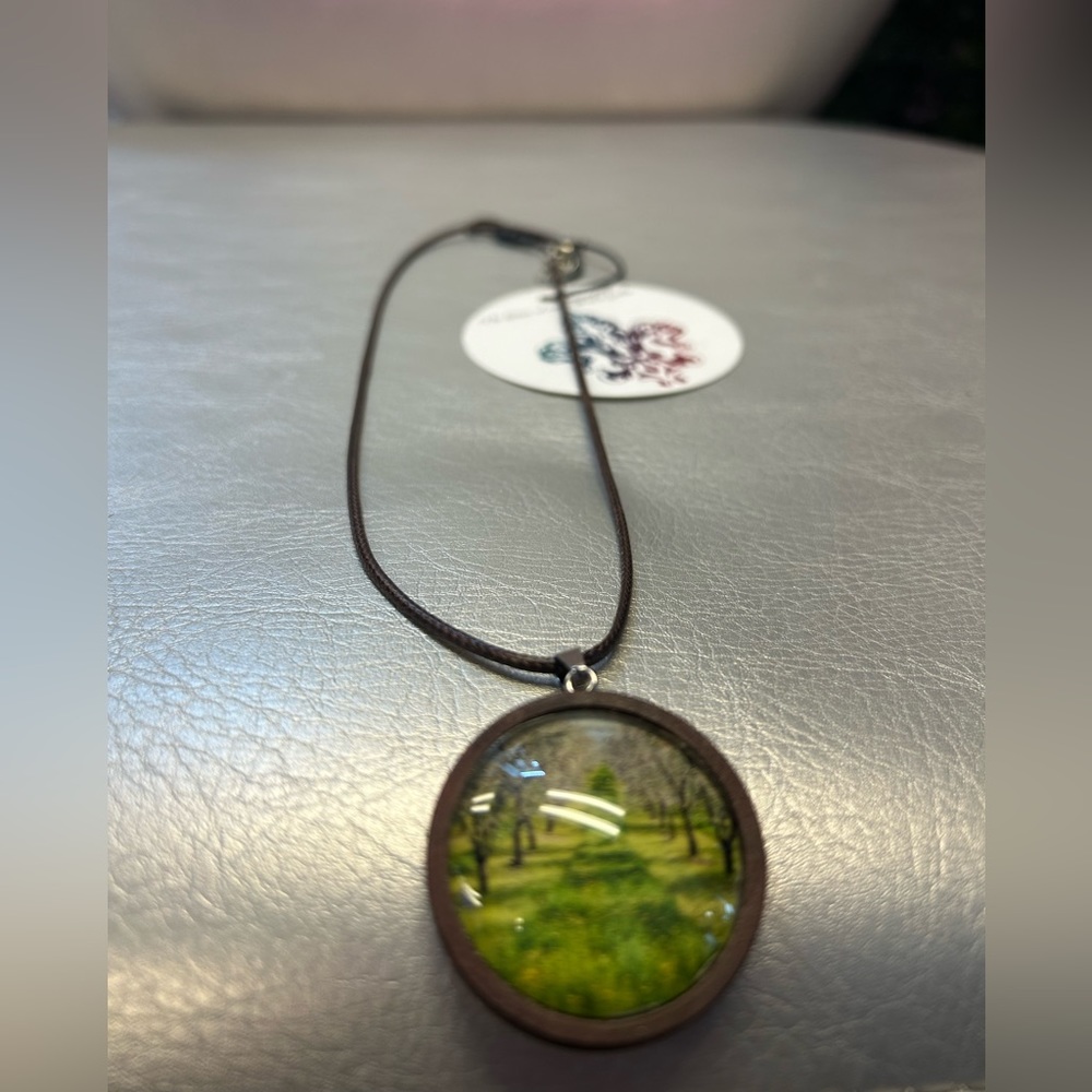 Glass pendant with leather necklace metal clasp